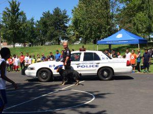 Students line up to greet the police dog.